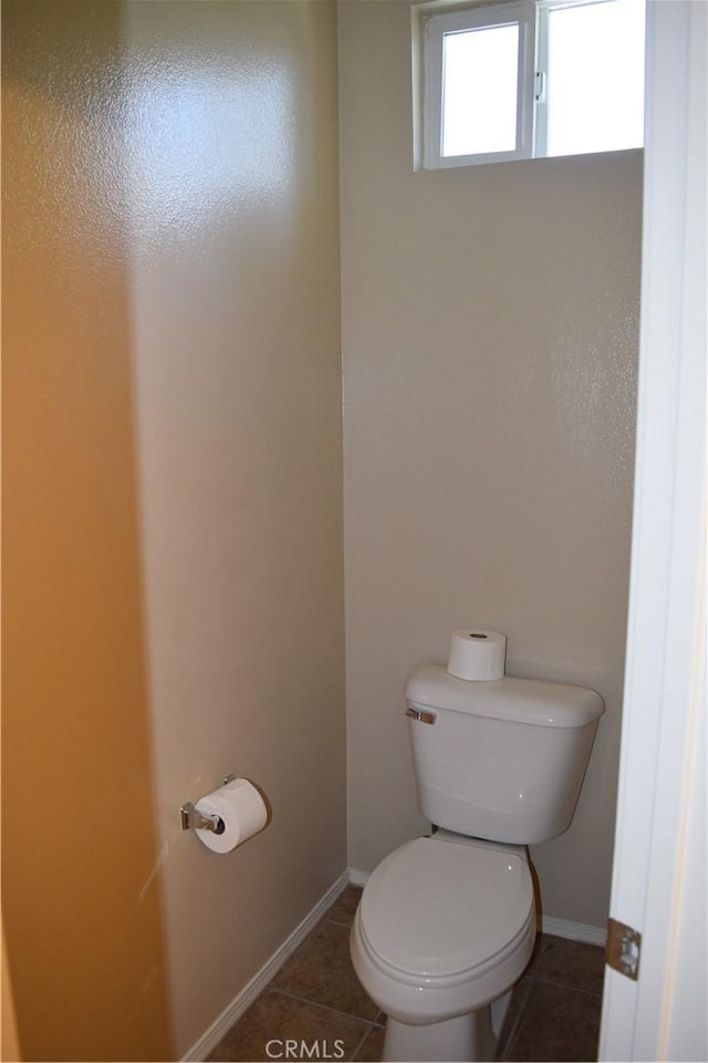 bathroom featuring tile patterned floors and toilet