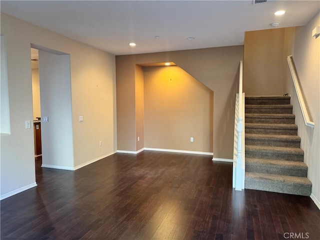 unfurnished room featuring dark hardwood / wood-style floors