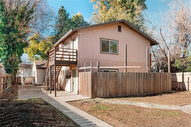 view of side of home featuring a patio area