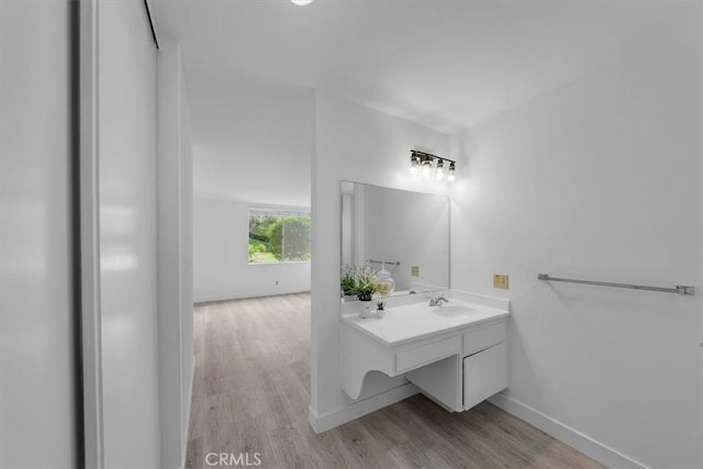 bathroom with vanity and hardwood / wood-style floors