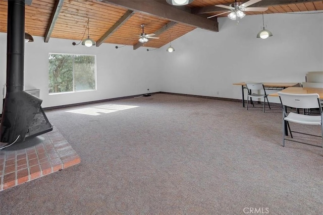 unfurnished living room featuring wood ceiling, high vaulted ceiling, a wood stove, beamed ceiling, and carpet