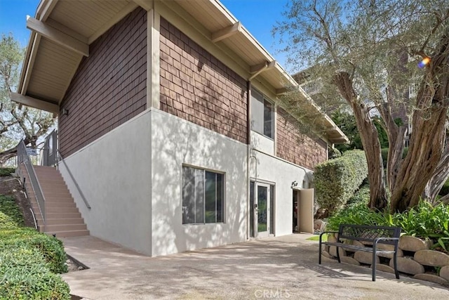 view of side of home with a patio