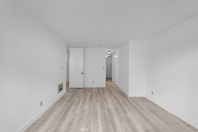 empty room featuring light hardwood / wood-style floors