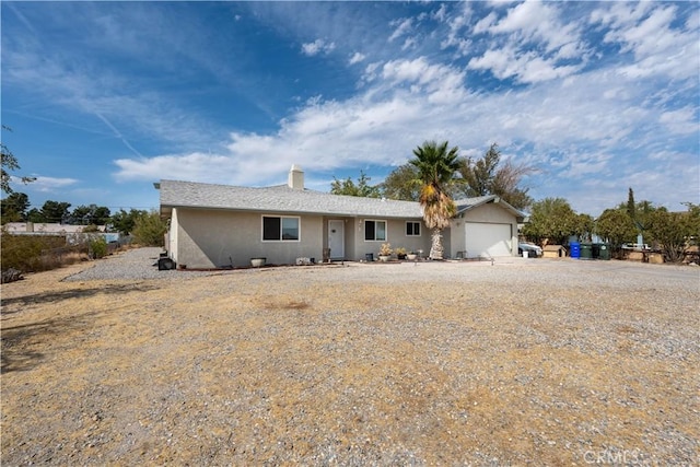 ranch-style home with a garage