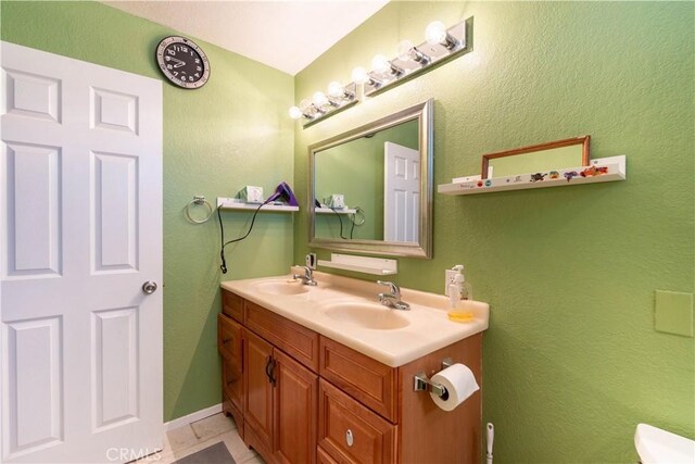 bathroom with tile patterned flooring and vanity