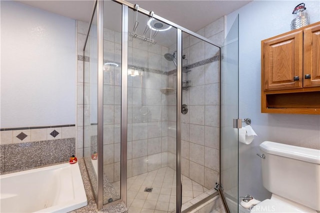 full bathroom featuring a garden tub, toilet, and a shower stall