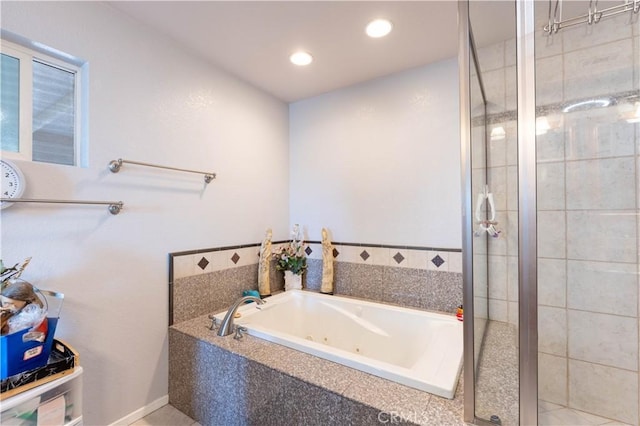 bathroom with plus walk in shower and tile patterned floors