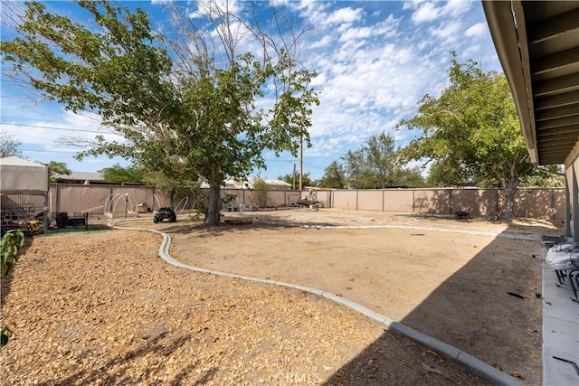 view of yard featuring a patio area and a fenced backyard