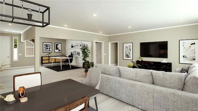 living room with crown molding and light hardwood / wood-style flooring