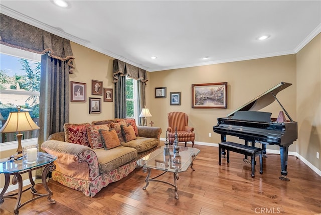 living room with hardwood / wood-style floors and ornamental molding