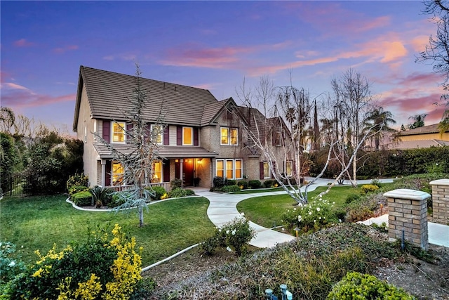 view of front of house featuring a lawn