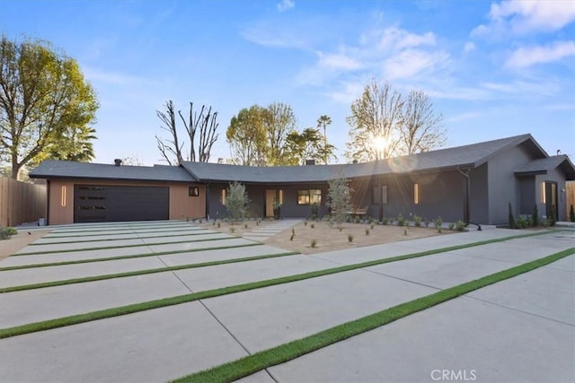 ranch-style home featuring a garage