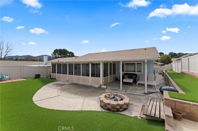 26478 Fairway Cir, Newhall, CA 91321 - back of property with an outdoor fire pit, a patio, a sunroom, and roof with shingles