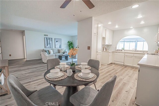 26478 Fairway Cir, Newhall, CA 91321 - dining room featuring light wood-style floors, ceiling fan, a textured ceiling, and recessed lighting