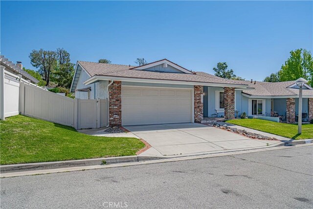 26478 Fairway Cir, Newhall, CA 91321 - single story home featuring an attached garage, concrete driveway, and brick siding
