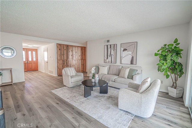 26478 Fairway Cir, Newhall, CA 91321 - living area with wood finished floors, a textured ceiling, and baseboards