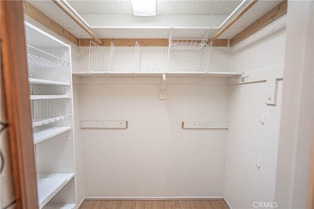 26478 Fairway Cir, Newhall, CA 91321 - walk in closet featuring wood finished floors