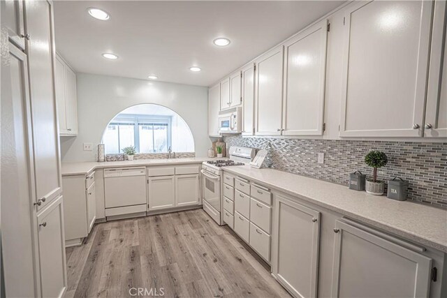 26478 Fairway Cir, Newhall, CA 91321 - kitchen featuring white appliances, a sink, white cabinets, light wood-type flooring, and recessed lighting