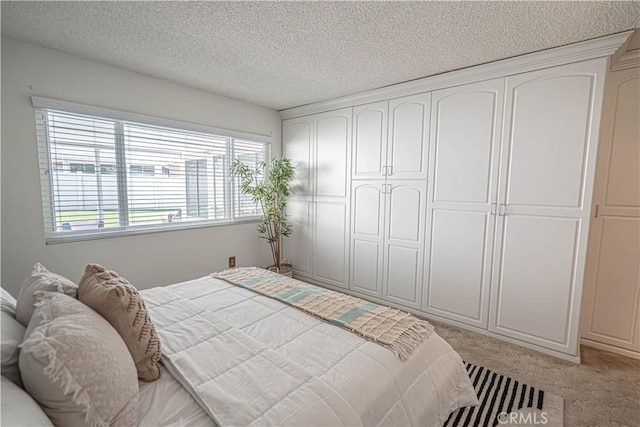 26478 Fairway Cir, Newhall, CA 91321 - bedroom with light colored carpet, a textured ceiling, and a closet
