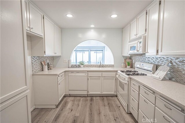 26478 Fairway Cir, Newhall, CA 91321 - kitchen with white appliances, a sink, light wood-style floors, tasteful backsplash, and recessed lighting