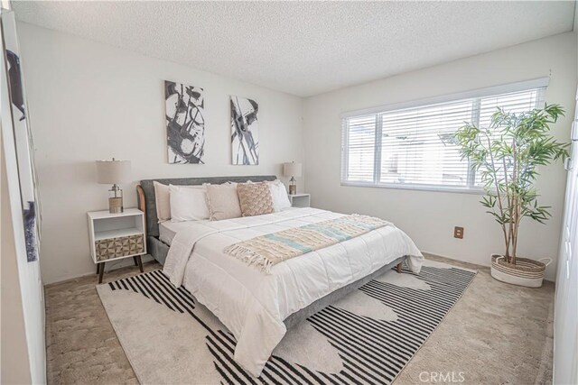 26478 Fairway Cir, Newhall, CA 91321 - bedroom with a textured ceiling and carpet