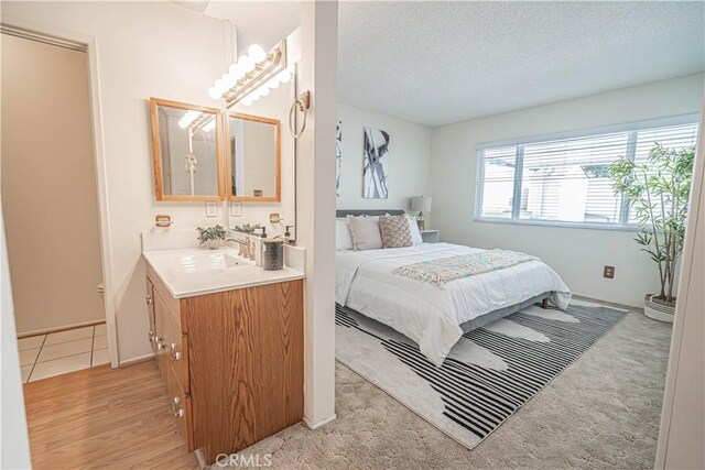 26478 Fairway Cir, Newhall, CA 91321 - bedroom with a sink, a textured ceiling, and baseboards