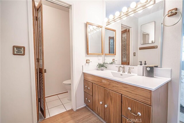 26478 Fairway Cir, Newhall, CA 91321 - bathroom featuring toilet, vanity, and tile patterned flooring