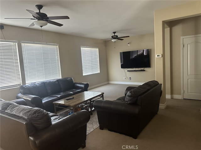 living room with a healthy amount of sunlight, ceiling fan, and carpet flooring