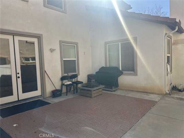 entrance to property with a patio and french doors