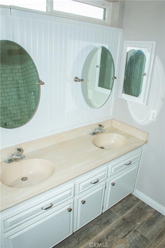 bathroom featuring vanity and hardwood / wood-style floors