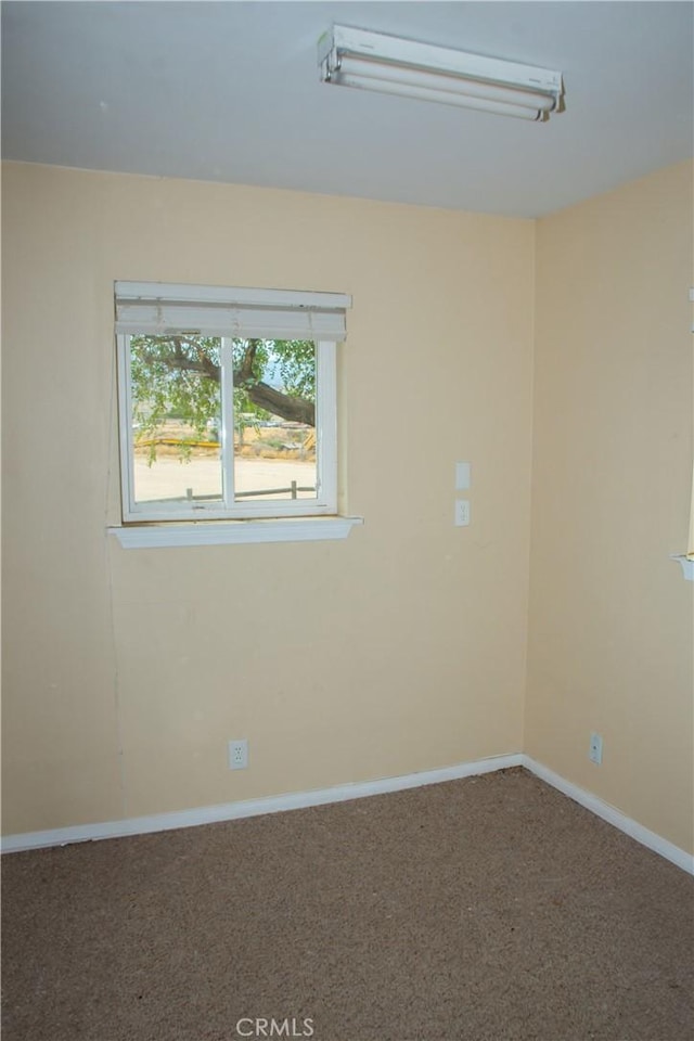 empty room with carpet flooring