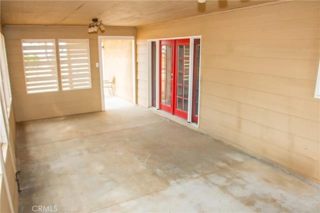 interior space with wood ceiling and concrete floors