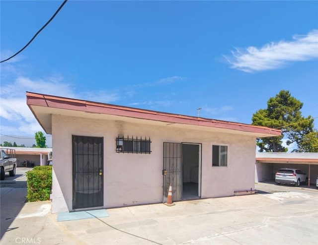 rear view of house with a carport