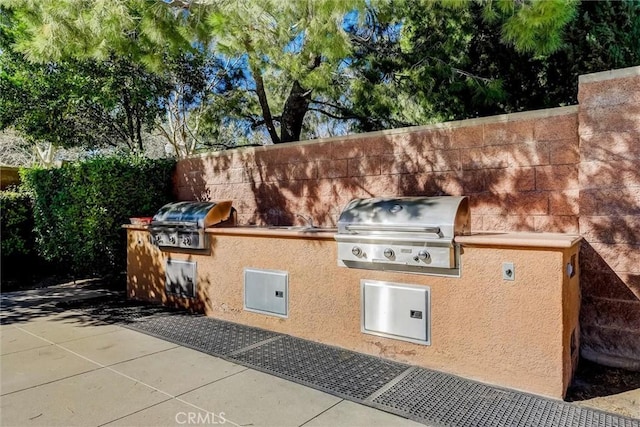 view of patio with a grill and exterior kitchen