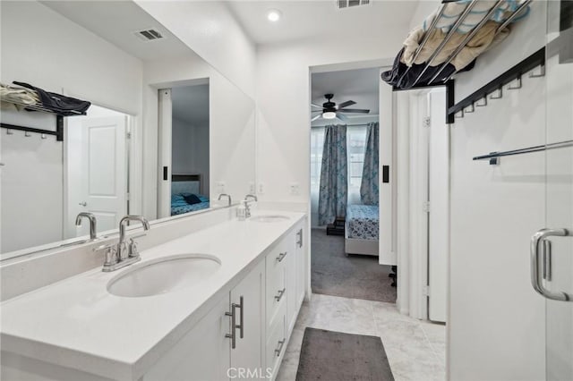 bathroom featuring vanity, an enclosed shower, tile patterned floors, and ceiling fan