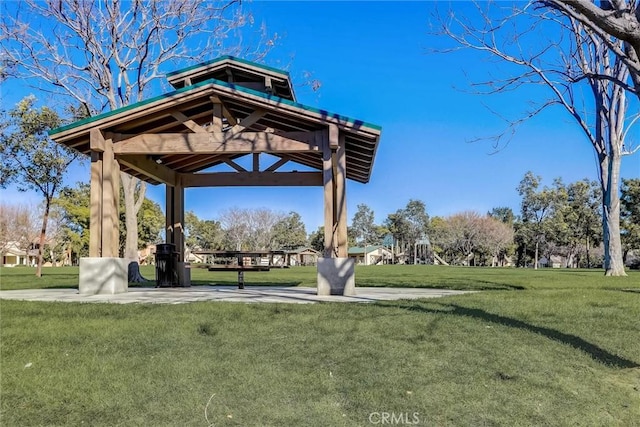 surrounding community with a gazebo and a lawn