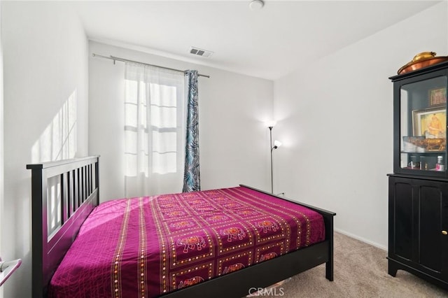 bedroom featuring light colored carpet