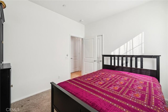 bedroom with light carpet