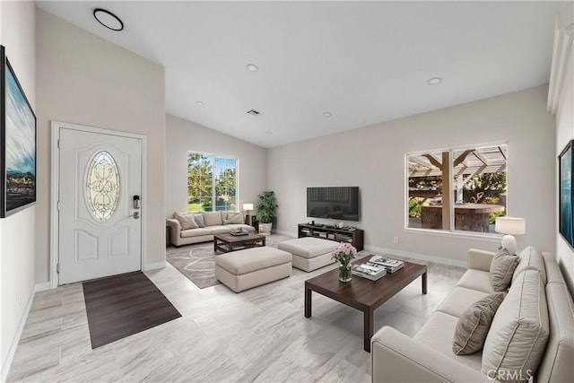 living room featuring lofted ceiling