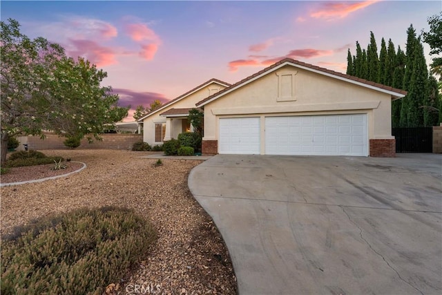 ranch-style home featuring a garage