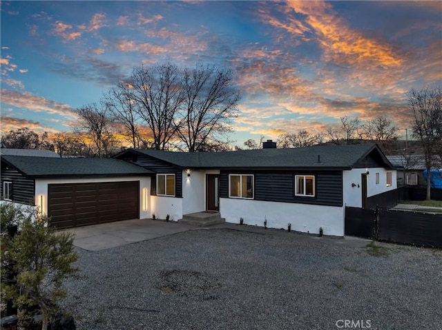 ranch-style house featuring a garage