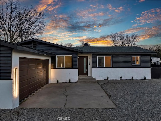 single story home with a garage