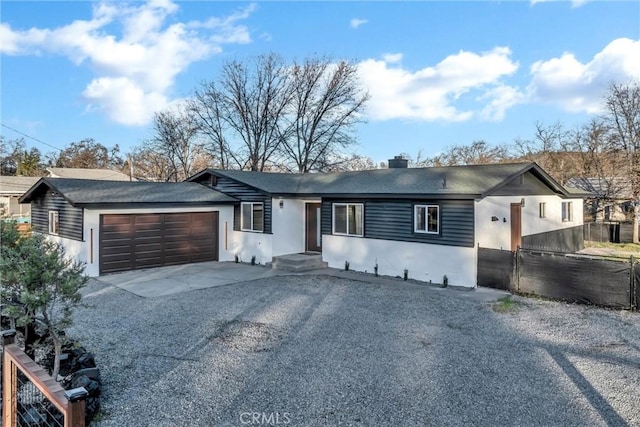 single story home with a garage