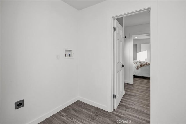 laundry room with hardwood / wood-style flooring, hookup for a washing machine, and electric dryer hookup