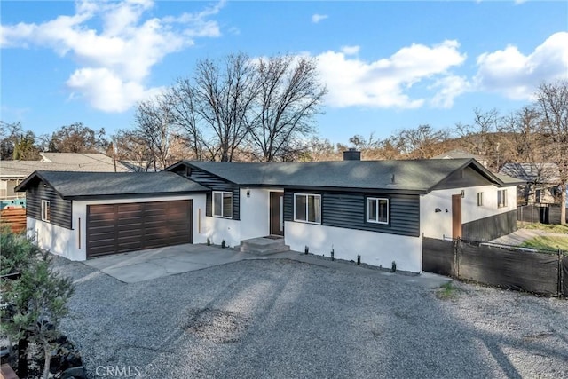 single story home with a garage