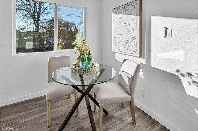 dining area with hardwood / wood-style flooring and a wealth of natural light