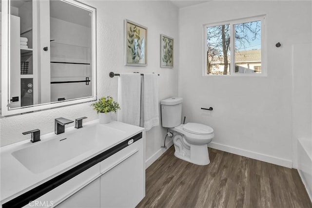 bathroom featuring hardwood / wood-style flooring, vanity, and toilet