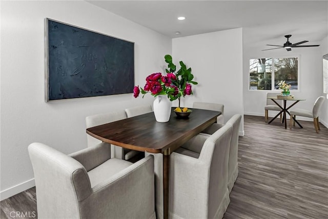 dining room with dark hardwood / wood-style floors and ceiling fan