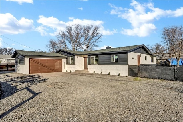 single story home featuring a garage