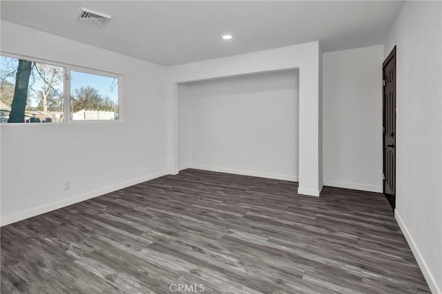 interior space with dark hardwood / wood-style flooring